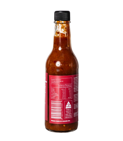 Bottle of hot sauce with a red label on a white background