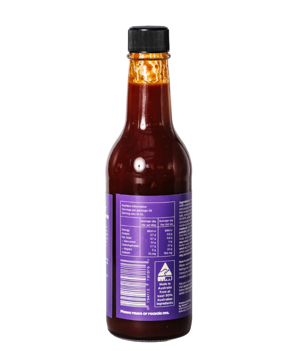 Bottle of hot sauce with a purple label on a white background