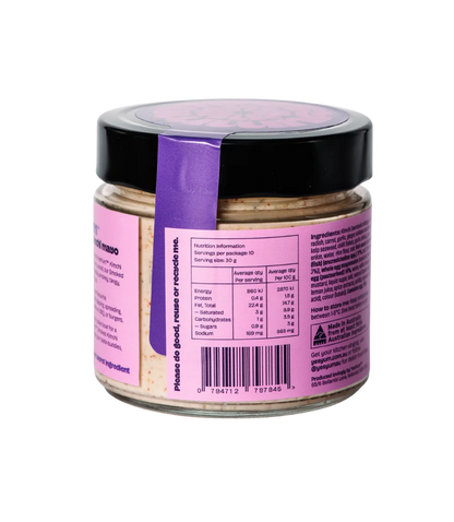 Jar with a purple label and black lid on a white background