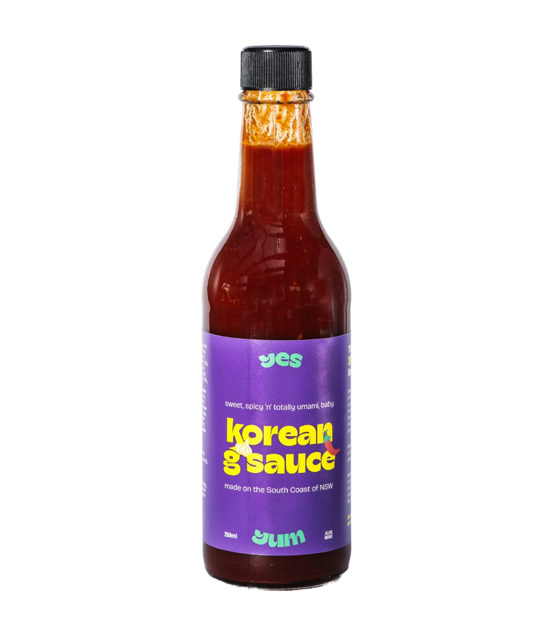 Bottle of Korean G Sauce with a purple label on a white background