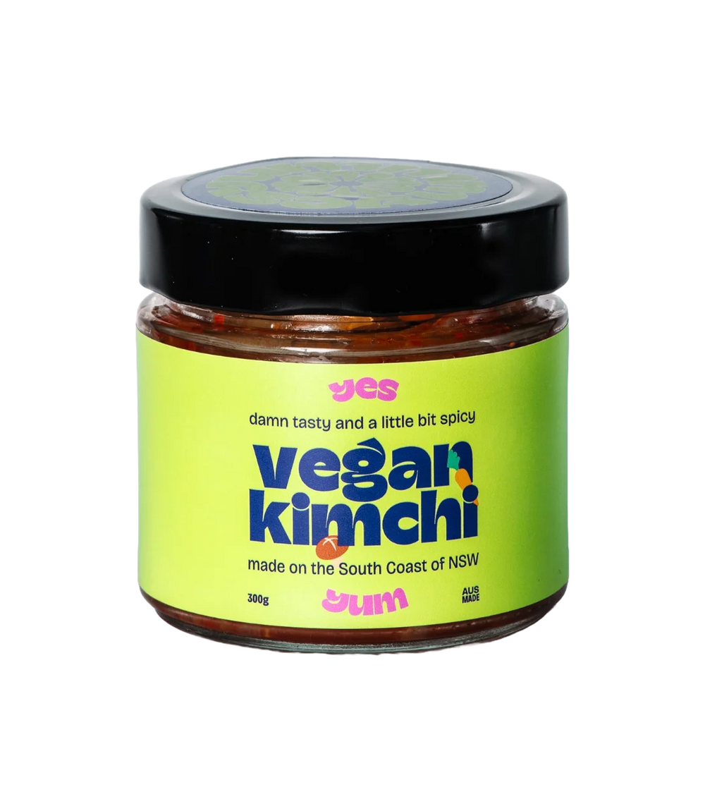 Jar of vegan kimchi with a green label on a white background