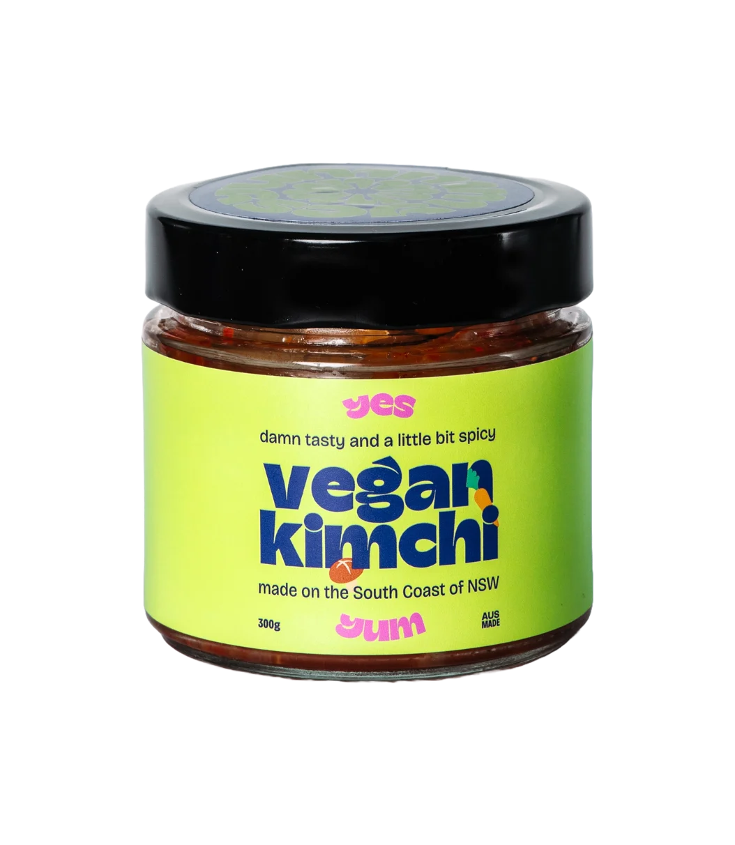 Jar of vegan kimchi with a green label on a white background